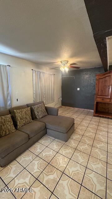 3530 W Portland St, Phoenix, AZ 85009 - living area featuring a ceiling fan and a textured ceiling