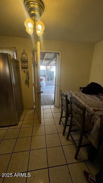 3530 W Portland St, Phoenix, AZ 85009 - dining room with ceiling fan and light tile patterned flooring