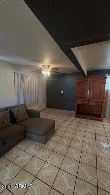3530 W Portland St, Phoenix, AZ 85009 - living room with ceiling fan, light tile patterned floors, and a textured ceiling