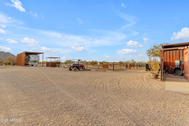 view of yard with a rural view