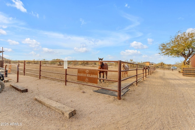 view of stable featuring a rural view