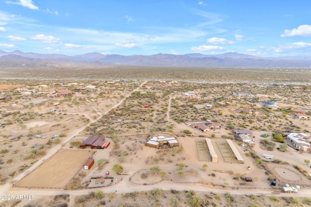 birds eye view of property featuring a mountain view