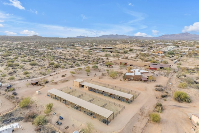 birds eye view of property featuring a mountain view