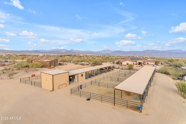 birds eye view of property featuring a mountain view