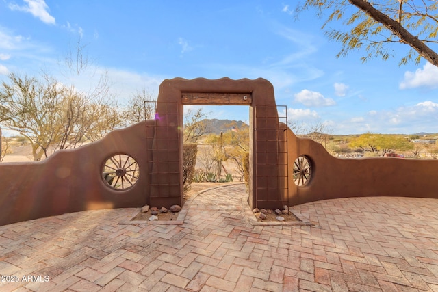 view of gate with a mountain view