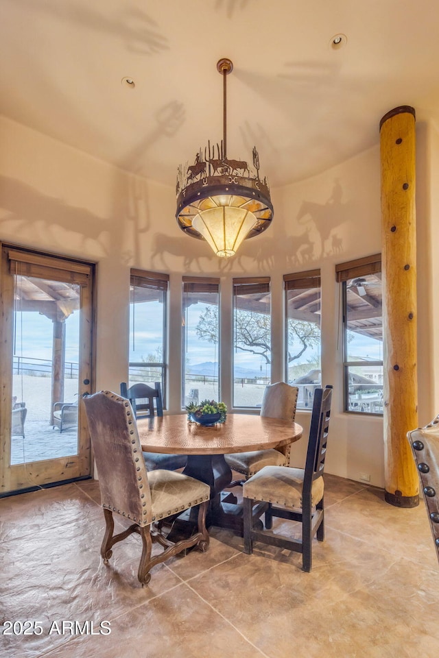 dining room with vaulted ceiling