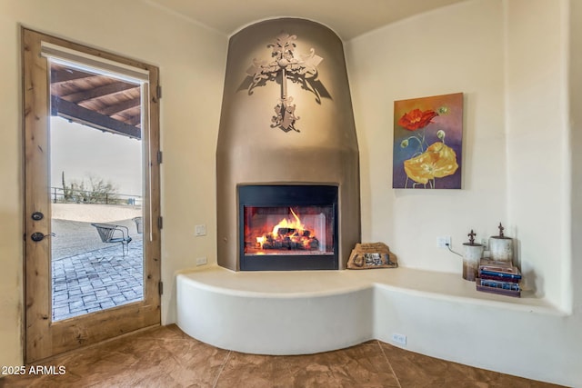 bathroom featuring a large fireplace and tile patterned floors