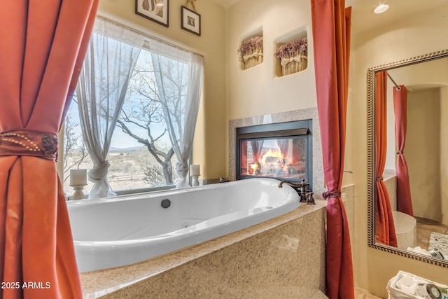 bathroom with tiled bath