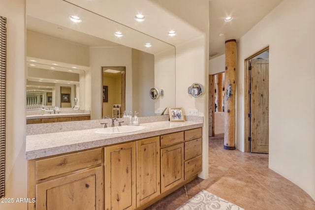 bathroom featuring vanity and tile patterned flooring