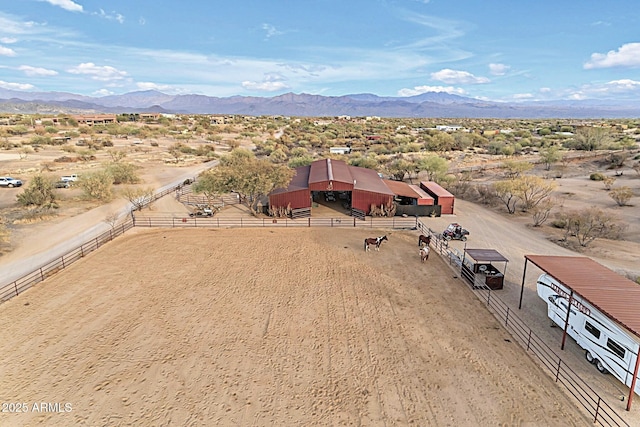 birds eye view of property featuring a mountain view