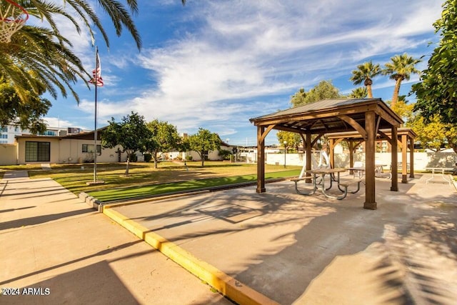 view of property's community featuring a lawn and a gazebo