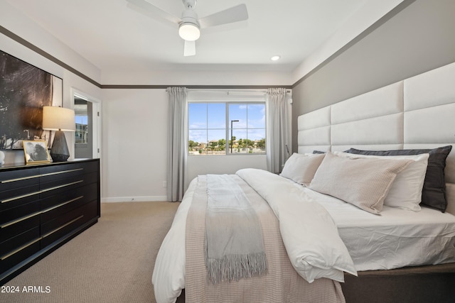 bedroom with carpet flooring, a ceiling fan, and baseboards