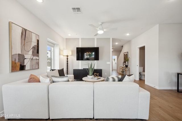 living area featuring visible vents, recessed lighting, a ceiling fan, and wood finished floors