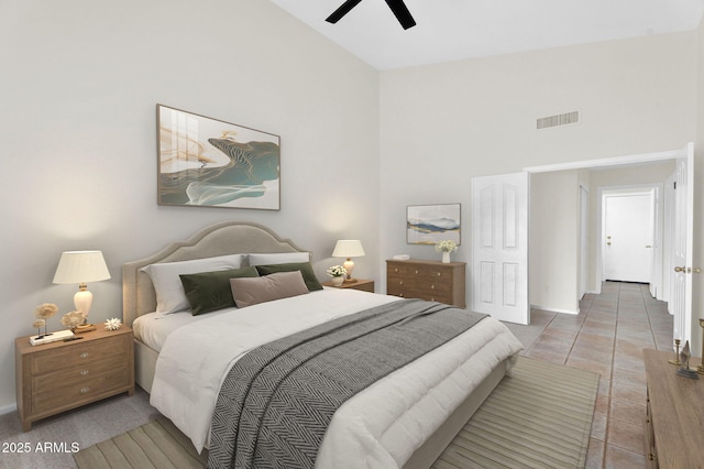 bedroom featuring high vaulted ceiling, baseboards, and ceiling fan