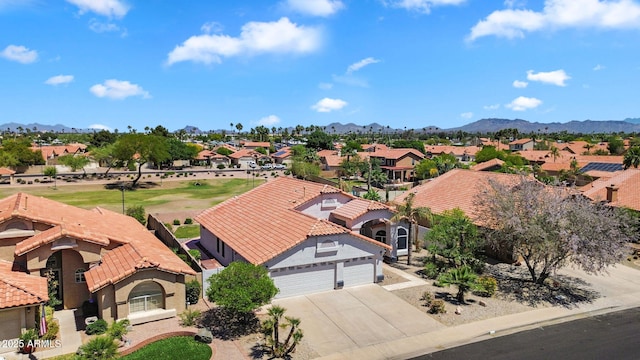 aerial view of residential area with a mountain backdrop