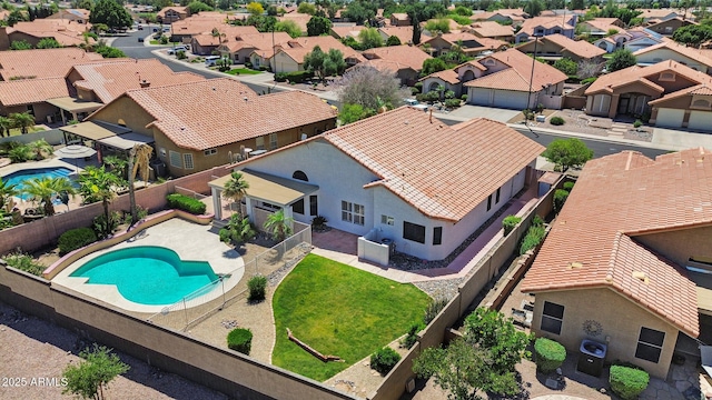 aerial view of residential area featuring a pool
