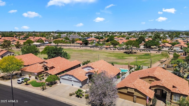 aerial perspective of suburban area with a mountainous background