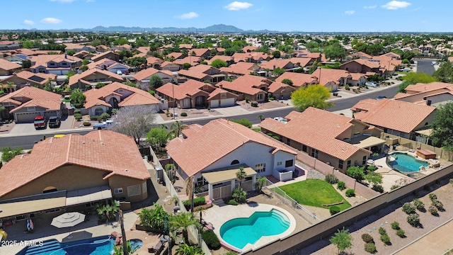 aerial view of residential area featuring a pool area