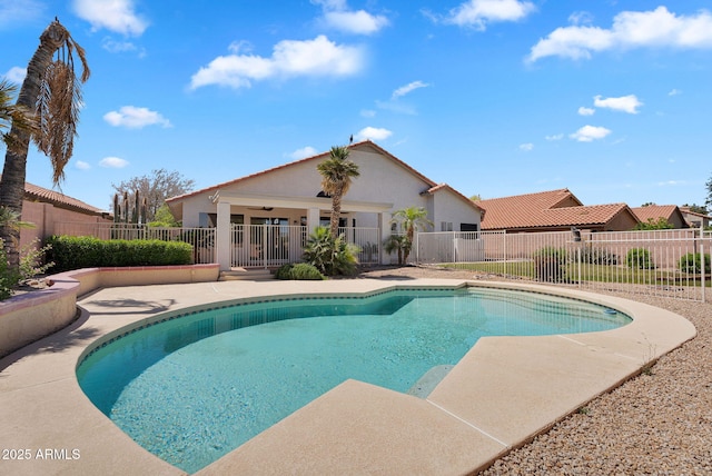 view of pool featuring a patio and fence