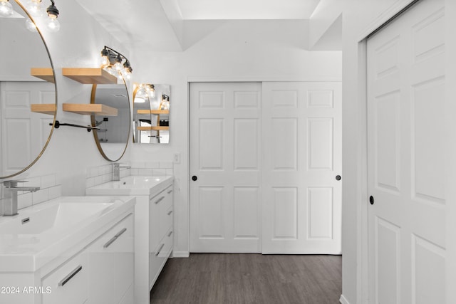 bathroom featuring hardwood / wood-style floors and vanity