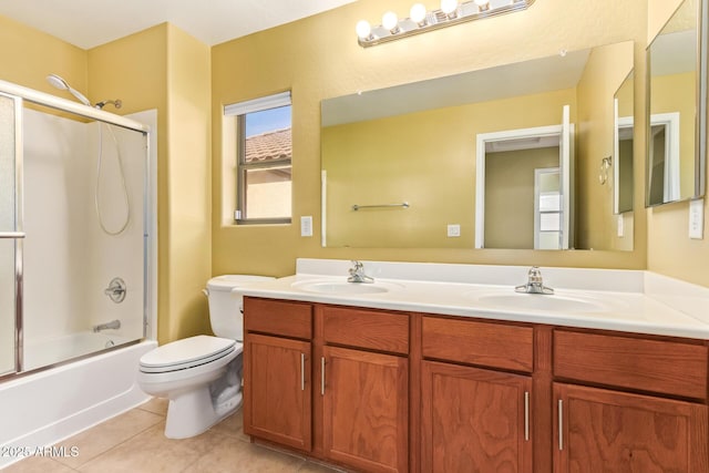 full bathroom with toilet, vanity, tile patterned floors, and combined bath / shower with glass door