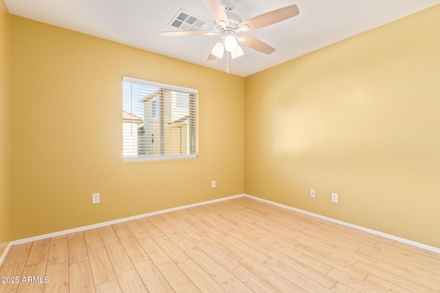 empty room featuring ceiling fan and light hardwood / wood-style floors