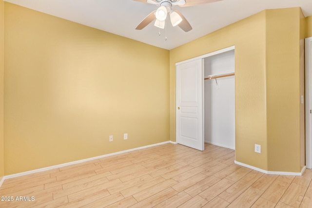 unfurnished bedroom featuring a closet, ceiling fan, and light wood-type flooring