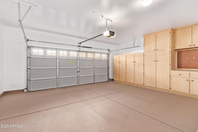 garage featuring a garage door opener