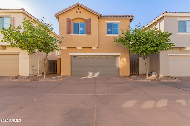 mediterranean / spanish-style home with a garage