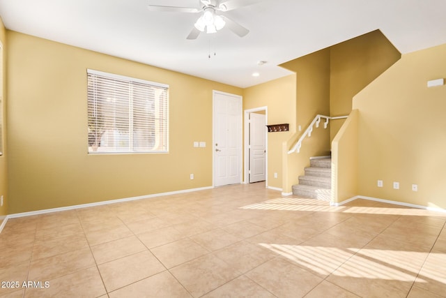 entrance foyer featuring ceiling fan and light tile patterned floors