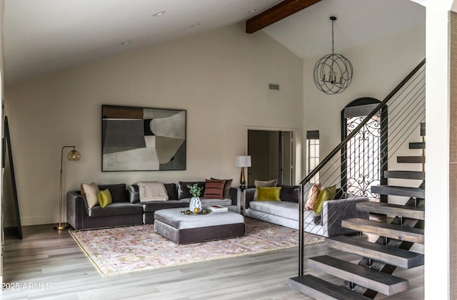 10266 E Caron St, Scottsdale, AZ 85258 - living area featuring wood finished floors, high vaulted ceiling, beamed ceiling, stairway, and baseboards