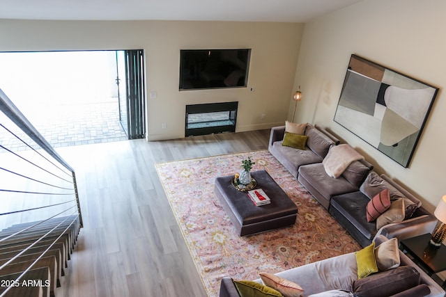 10266 E Caron St, Scottsdale, AZ 85258 - living area featuring healthy amount of natural light, wood finished floors, and a fireplace