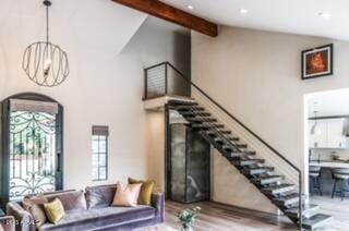 10266 E Caron St, Scottsdale, AZ 85258 - living area featuring beamed ceiling, wood finished floors, arched walkways, recessed lighting, and high vaulted ceiling