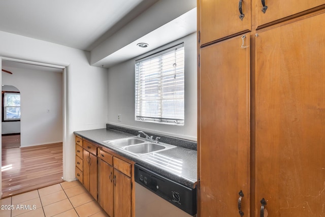 kitchen with sink, light tile patterned floors, and dishwasher