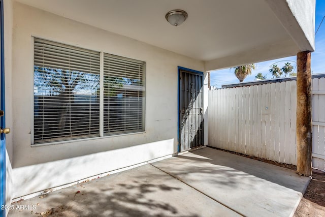 entrance to property featuring a patio area