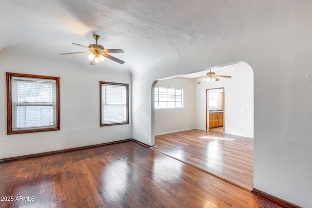 spare room with wood-type flooring and ceiling fan