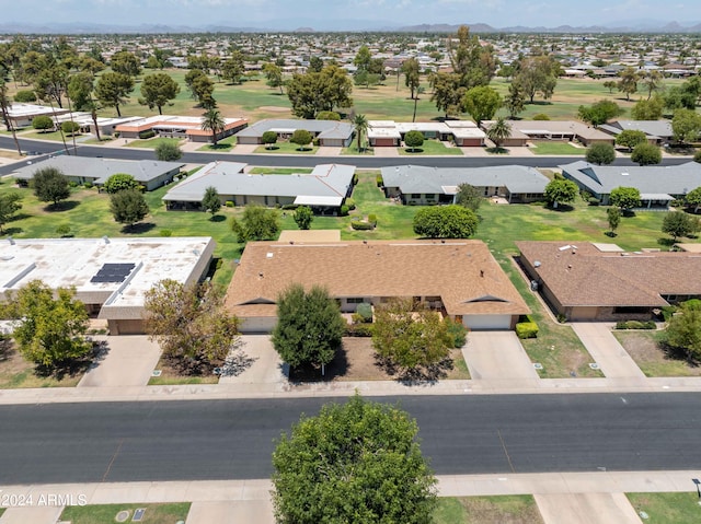 birds eye view of property with a residential view