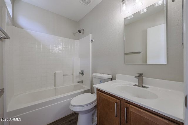 full bathroom featuring toilet, wood finished floors, vanity, visible vents, and shower / bathing tub combination