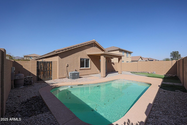 view of pool featuring a fenced in pool, a fenced backyard, a patio, and central air condition unit