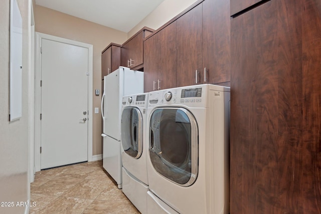 laundry area featuring cabinet space and washer and dryer