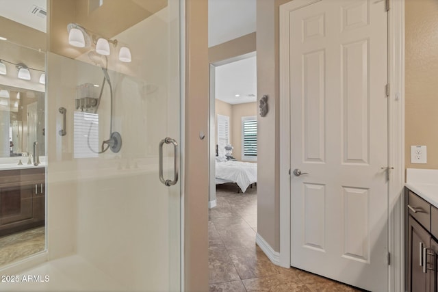 bathroom featuring a stall shower, visible vents, vanity, and ensuite bath