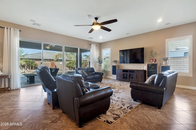 tiled living room with baseboards, visible vents, a ceiling fan, and recessed lighting