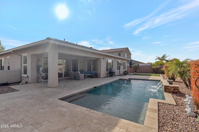 view of swimming pool featuring a fenced in pool, a patio, grilling area, an outdoor hangout area, and a fenced backyard