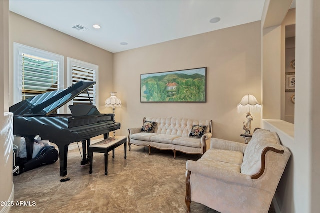 living area featuring visible vents