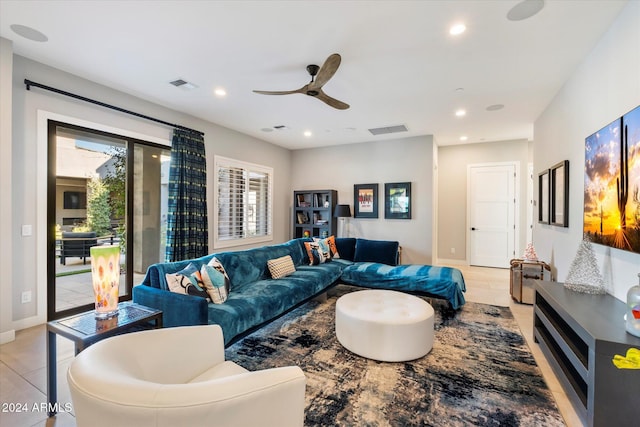 living room featuring light tile patterned floors and ceiling fan