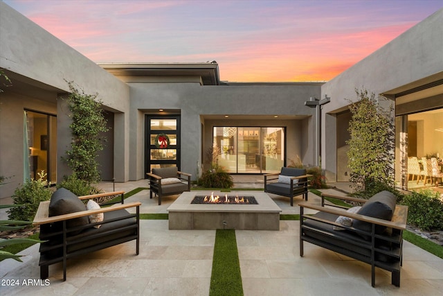 exterior space with an outdoor fire pit