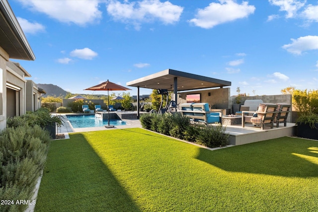 view of yard with pool water feature, an outdoor hangout area, a mountain view, and a patio area