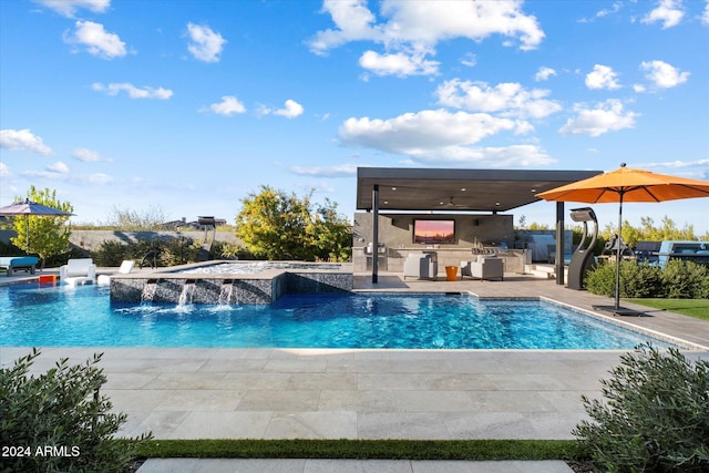 view of pool featuring area for grilling, a patio, and pool water feature