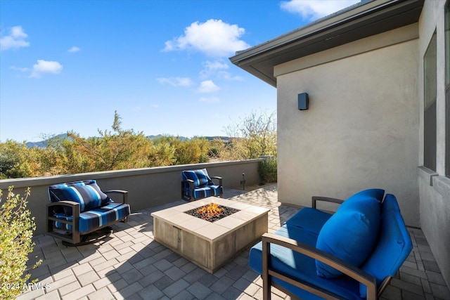 view of patio / terrace featuring an outdoor living space with a fire pit