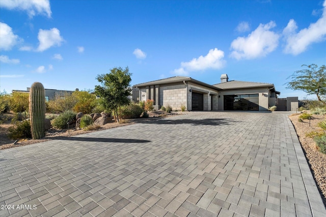 ranch-style house featuring a garage